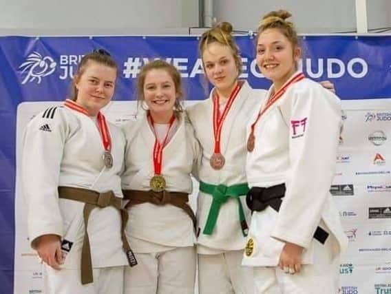 Karis Haughton-Brown, of Vale Judo Club, on the podium with her gold medal and the other top competitors, as she won in the under 70kg at the British Schools Judo Championship