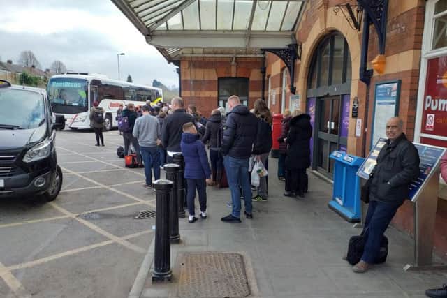 Passengers waiting to board replacement buses at Kettering station