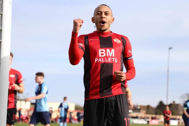 Rhys Hoenes celebrates after scoring Kettering Town's opening goal from the penalty spot in their 2-0 win over St Neots Town at Latimer Park. Picture by Peter Short