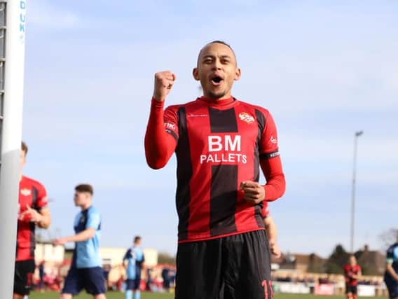 Rhys Hoenes celebrates after scoring Kettering Town's opening goal from the penalty spot in their 2-0 win over St Neots Town at Latimer Park. Picture by Peter Short