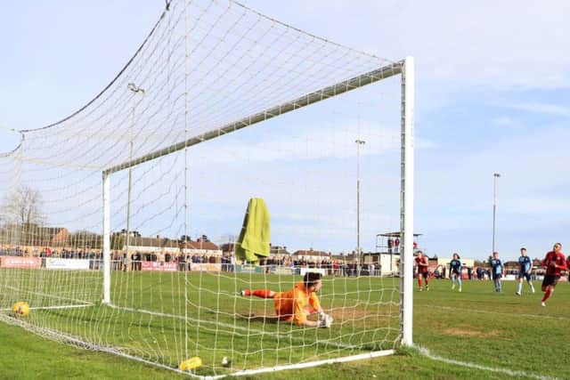 Rhys Hoenes scores from the penalty spot to give Kettering Town the lead in their 2-0 victory over St Neots Town. Pictures by Peter Short