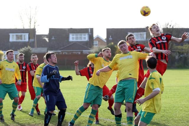 Goalmouth action from the 0-0 draw between Irchester United and Holwell Sports in Division One. Pictures by Alison Bagley
