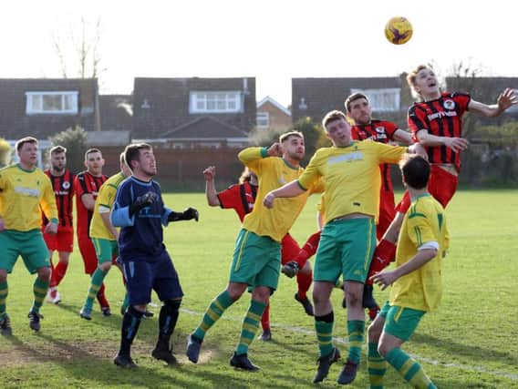 Goalmouth action from the 0-0 draw between Irchester United and Holwell Sports in Division One. Pictures by Alison Bagley