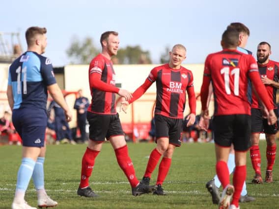 Declan Towers enjoys the moment after he headed home Kettering Town's second goal in their 2-0 success over St Neots Town at Latimer Park. Pictures by Peter Short