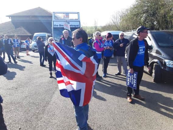 Many marchers were draped in Union Jack flags.