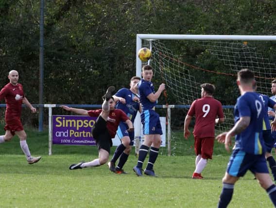 Goalmouth action from Thrapston Venturas 5-0 victory over Spratton Reserves in Division Three. Picture by Alison Bagley
