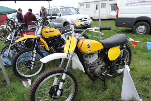 Display of classic scramblers including Suzuki and Greeves at Woodford last year.