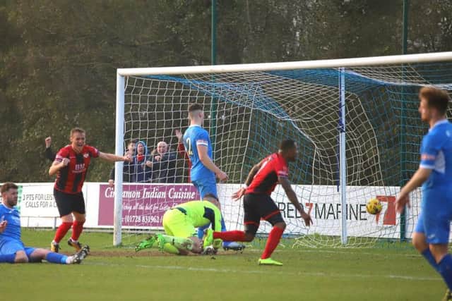 Aaron O'Connor scores Kettering's winning goal at Leiston