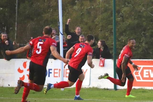Aaron O'Connor's face tells the story as he wheels away after scoring Kettering Town's stoppage-time winner in the 1-0 success at Leiston, which put them on the brink of the title. Pictures by Peter Short