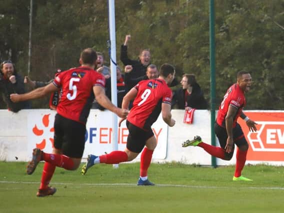 Aaron O'Connor's face tells the story as he wheels away after scoring Kettering Town's stoppage-time winner in the 1-0 success at Leiston, which put them on the brink of the title. Pictures by Peter Short