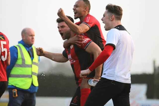 Michael Richens and Rhys Hoenes celebrate after the final whistle