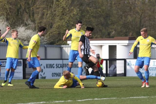 Joel Carta, who scored twice, is challenged in the area by a Berkhamsted opponent