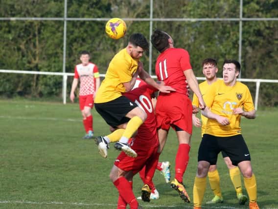Action from Rothwell Corinthians' 1-1 draw with Harborough Town in the UCL Premier Division. Pictures by Alison Bagley
