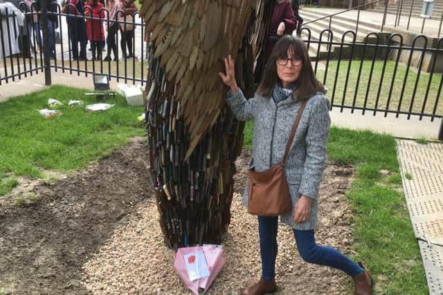 Gill Veysey with the Knife Angel sculpture.