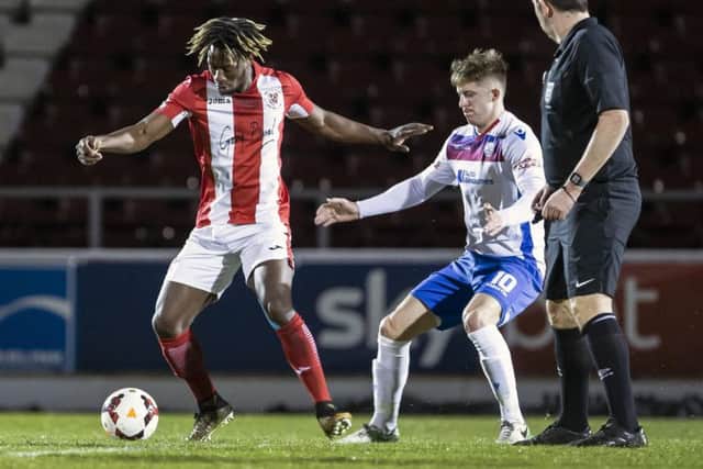 Ben Diamond, pictured during Tuesday's NFA Hillier Senior Cup final against Brackley Town, is a doubt for AFC Rushden & Diamonds' trip to St Ives Town after he suffered an ankle injury late on in the game at Sixfields. Picture by Kirsty Edmonds