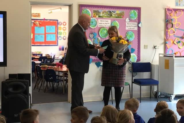 Mrs Havlickova receives her gifts from Duncan Mills