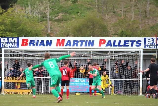 Alvechurch celebrate the goal that prevented Kettering Town from clinching the title this weekend as the Poppies were beaten 2-1 at Latimer Park. Pictures by Peter Short