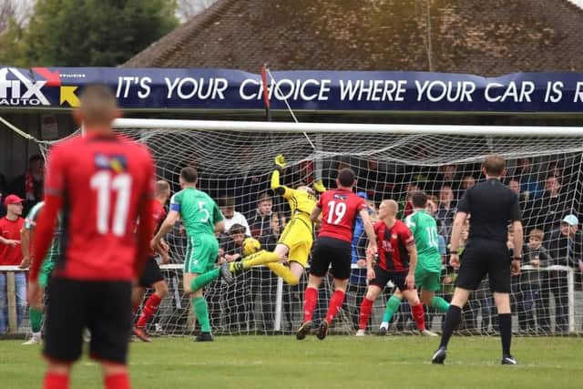 Poppies goalkeeper Paul White is beaten by Jamie Willets' early header
