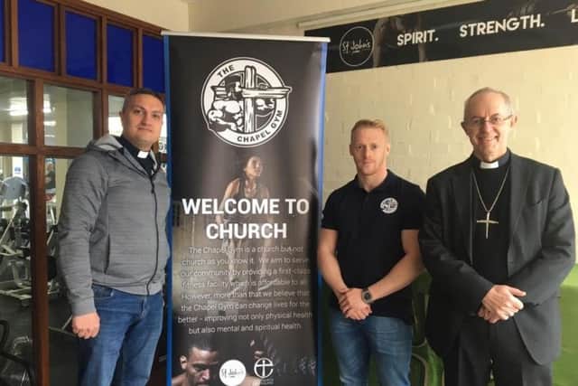 Reverend Paul Frost, gym manager Chris McGlone and Archbishop of Canterbury Justin Welby