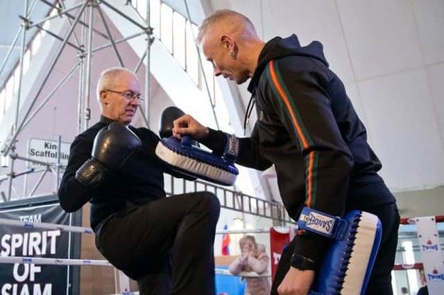 The Archbishop of Canterbury with thai boxing trainer Lee Wills
