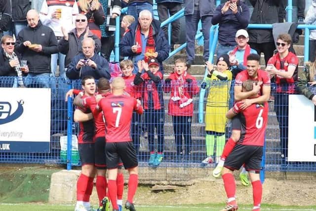 The Poppies players celebrate their winning goal at Halesowen. Picture by Peter Short
