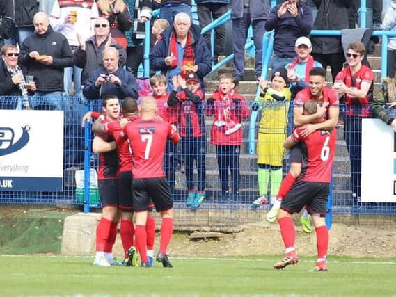 The Poppies players celebrate their winning goal at Halesowen. Picture by Peter Short