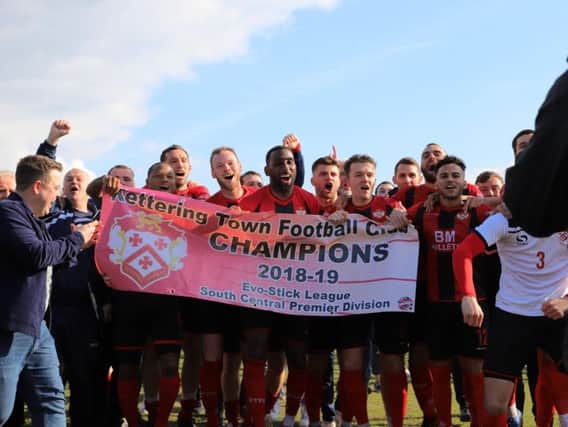 The Kettering Town players celebrate after they clinched the Evo-Stik League South Premier Division Central title with a 1-0 win at Halesowen Town. Pictures by Peter Short