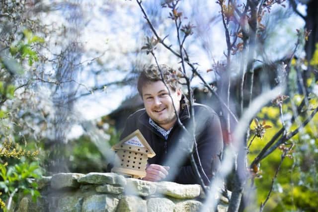Warner's conservation and sustainability manager Jonny Easter with one of the 1000 bee hotels set to be sent out across the country (Picture: Kirsty Edmonds)