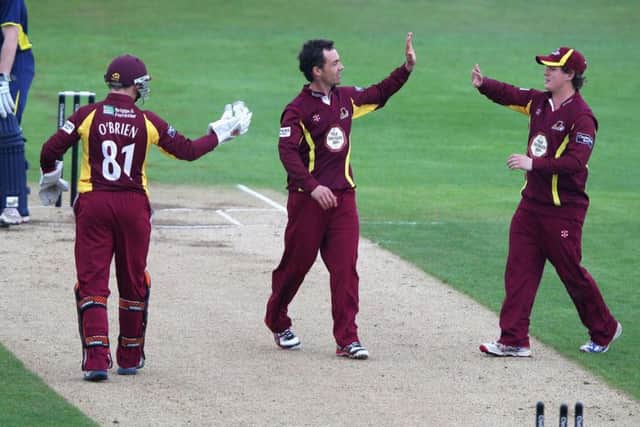 Con de Lange (centre) celebrates taking a wicket for Northants Steelbacks