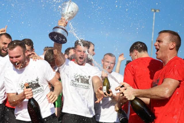 Kettering Town celebrated their title success after the 1-0 loss to Barwell at Latimer Park. Picture by Peter Short
