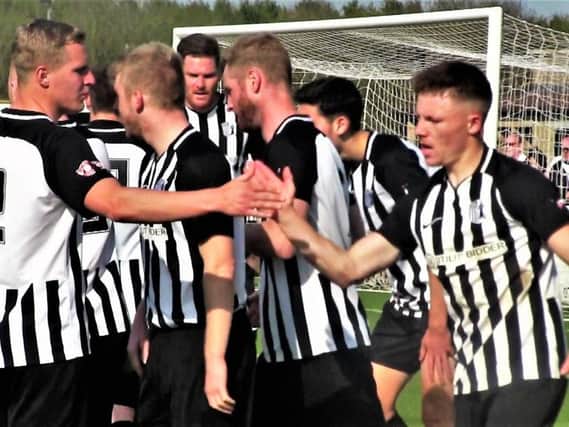 The Corby Town players celebrate one of their goals during the 3-2 success over Yaxley on Easter Monday. Picture by David Tilley