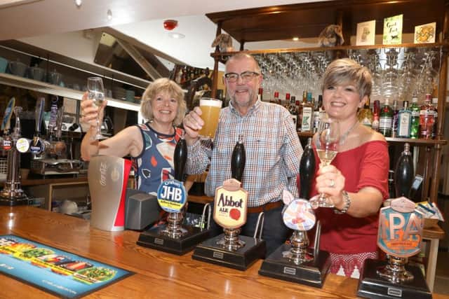 Pub re-opens: Isham: The Lilacs pub, re-opened after a huge community effort to renovate the last remaining pub in the village.
l-r Heather Davis, John Davis and Michele Mott - directors
Wednesday, 24th April 2019 NNL-190424-205302009