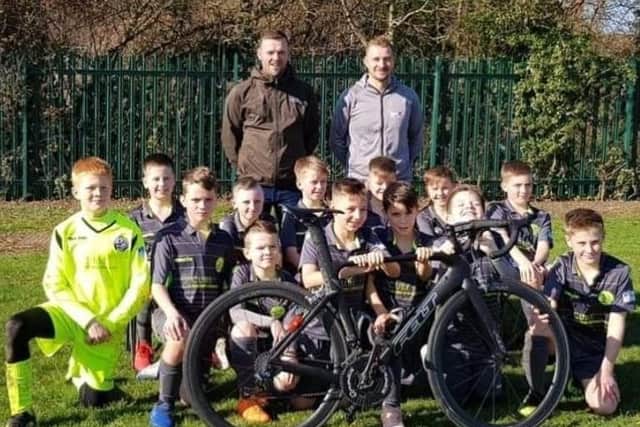 Darren Johnson and Christian Vann pictured with the AFC Rushden & Diamonds Fury Under-11 team
