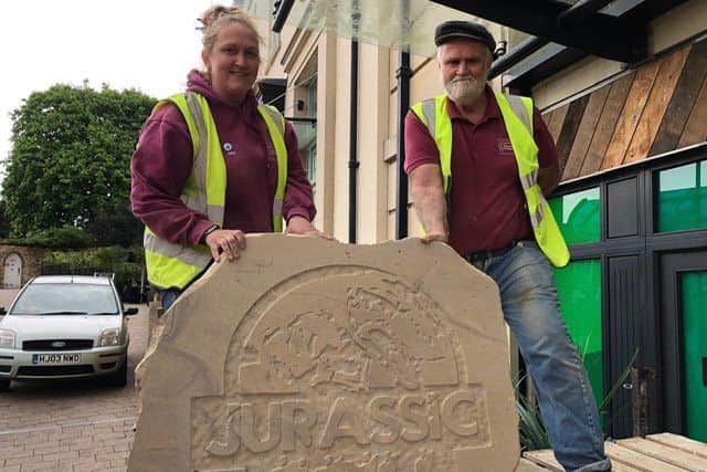 Mel and John Finnemore from Finnemore Stonemasons putting the new limestone up at Jurassic Grill yesterday NNL-190425-211243005
