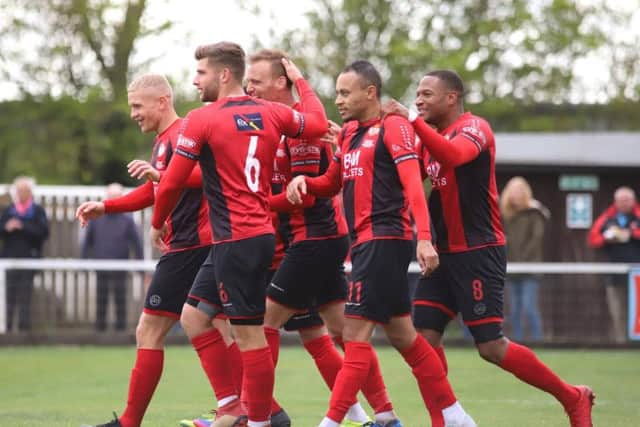 Brett Solkhon takes the congratulations after scoring Kettering Town's second goal in the 5-1 win over Stratford Town on the final day of the season. Picture by Peter Short