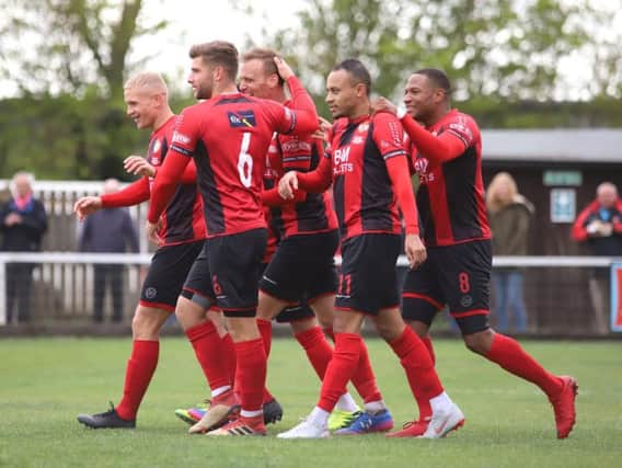 Brett Solkhon takes the congratulations after scoring Kettering Town's second goal in the 5-1 win over Stratford Town on the final day of the season. Picture by Peter Short