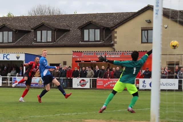 Rhys Hoenes fires home his and Kettering Town's first goal as they completed their fine season with a 5-1 victory over Stratford Town at Latimer Park. Pictures by Peter Short