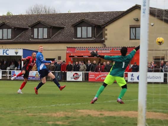 Rhys Hoenes fires home his and Kettering Town's first goal as they completed their fine season with a 5-1 victory over Stratford Town at Latimer Park. Pictures by Peter Short