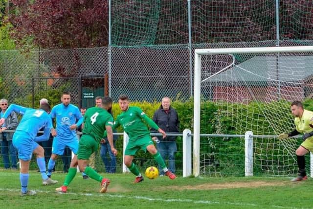 Elliot Sandy fires home his 31st goal of the season, which opened the scoring in Corby Town's 2-1 victory at Kidlington on Saturday. Picture by Jim Darrah