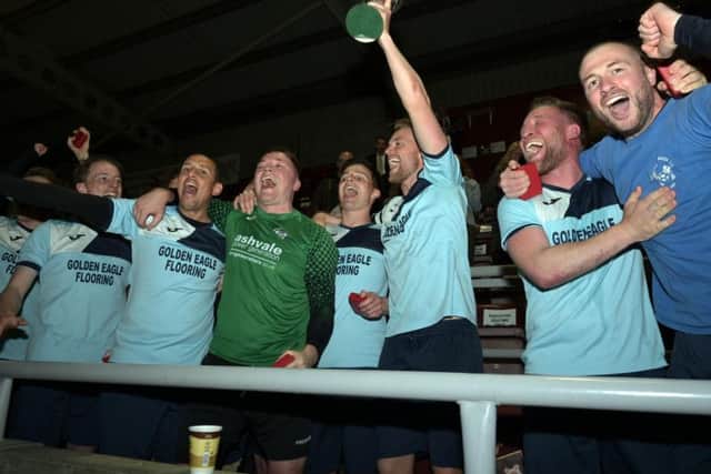 Kettering Nomads captain Jim Whittemore lifts the NFA Junior Cup after his team beat Blisworth 2-0 in the final at Sixfields. Picture by Dave Ikin