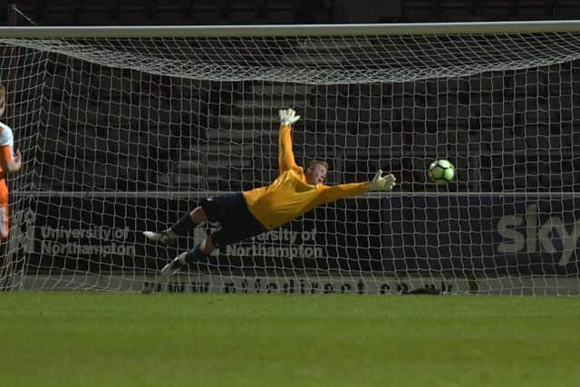 Mark Redding's fine strike beats Blisworth goalkeeper Jack Messinger to put Nomads 2-0 up
