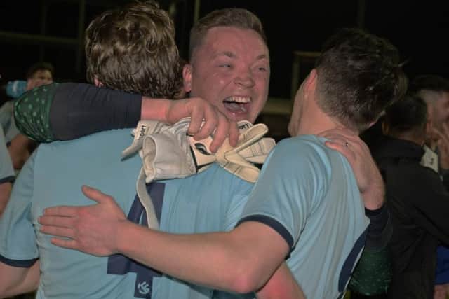 The smile of Kettering Nomads goalkeeper Brad Wilson tells the story as the celebrations begin
