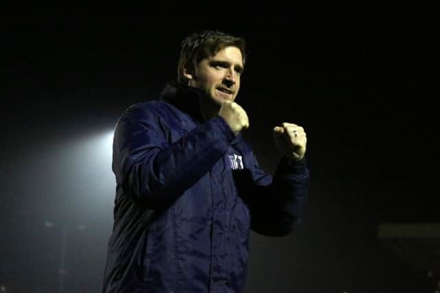 Steve Kinniburgh shows his delight at the final whistle after Corby Town beat Bedford Town 5-3 to book their spot in the Evo-Stik League South Division One Central play-off final. Pictures by Alison Bagley