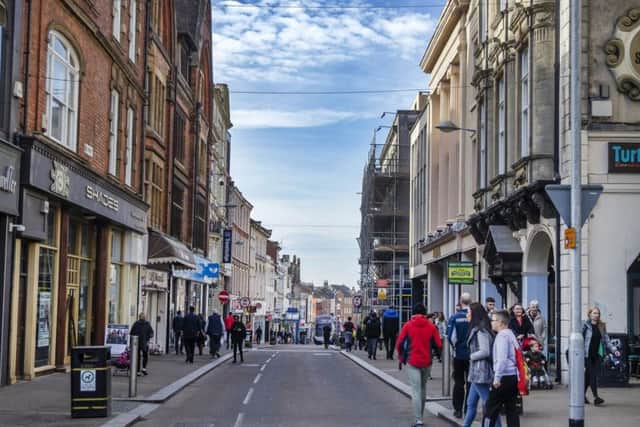 A stranger punched two women in the head in Northampton after a verbal altercation broke out.