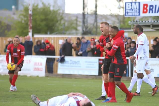 Brett Solkhon celebrates with Aaron O'Connor after he had brought the Poppies level