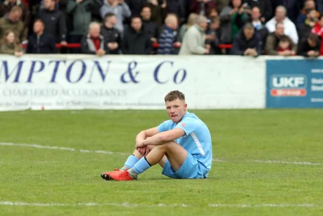 Jordon Crawford cuts a lonely figure after the final whistle as Corby Town missed out on promotion after their 4-3 defeat at Bromsgrove Sporting in the play-off final. Pictures by Alison Bagley