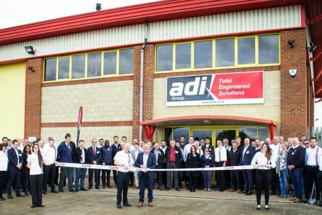 Johnny Herbert cuts the ribbon