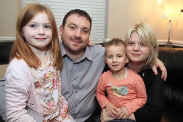 Niamh with sister Hannah, dad Chris and mum Samantha
