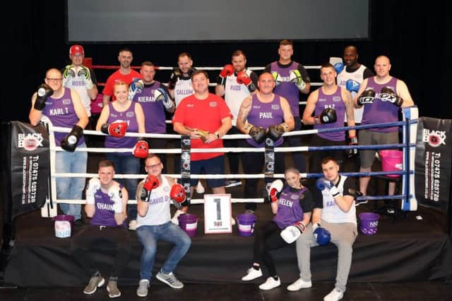 Chris Curry (centre, red shirt) surrounded by some of the Niamhs Next Step Fighting Fit Challenge participants (Picture: Alison Bagley)