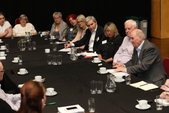 Alex Brazier (fourth from right) hosts the roundtable in Corby yesterday